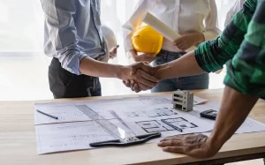contractor and agent shaking hands